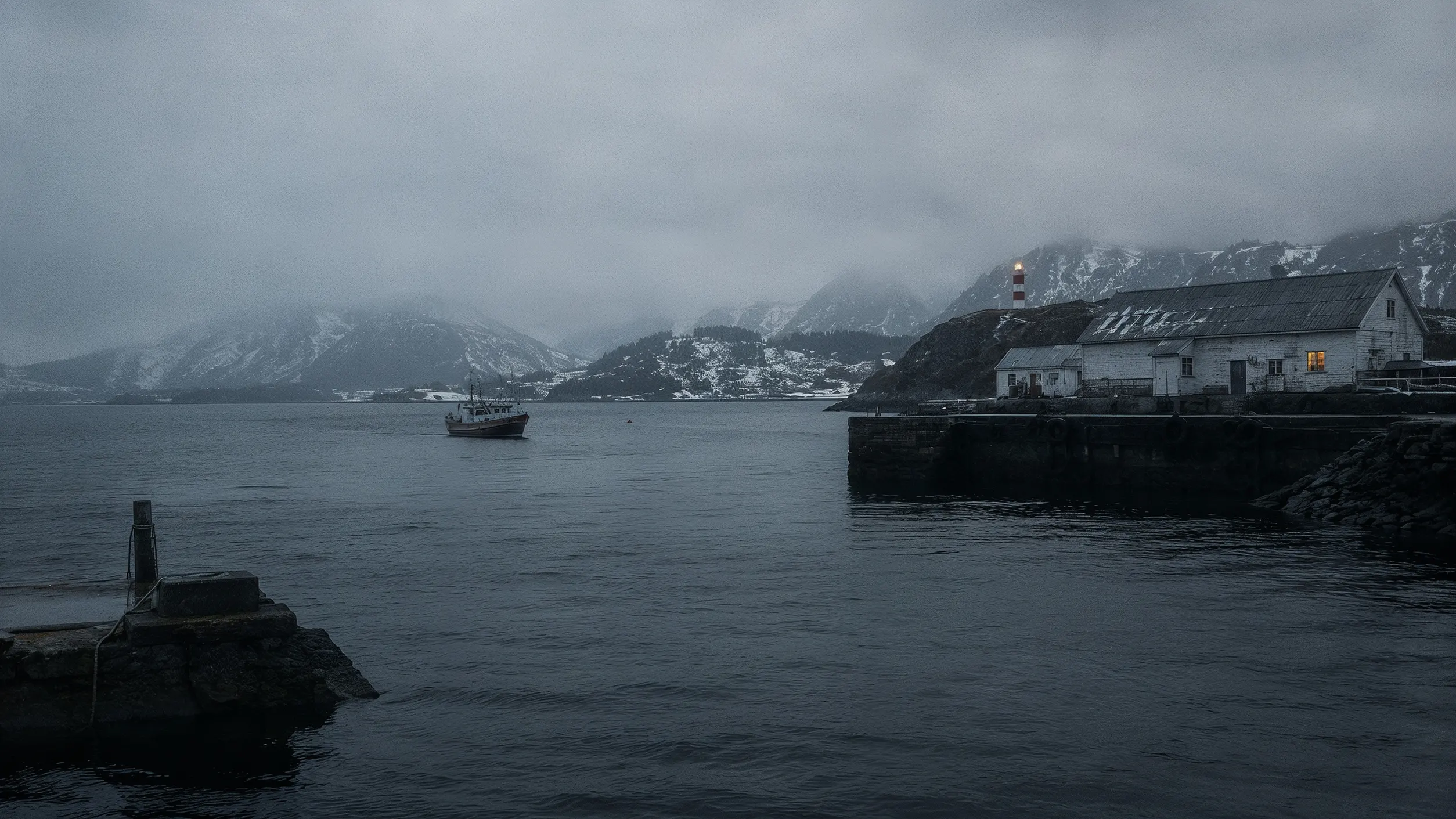 A misty harbor at dusk — a working light against weather.